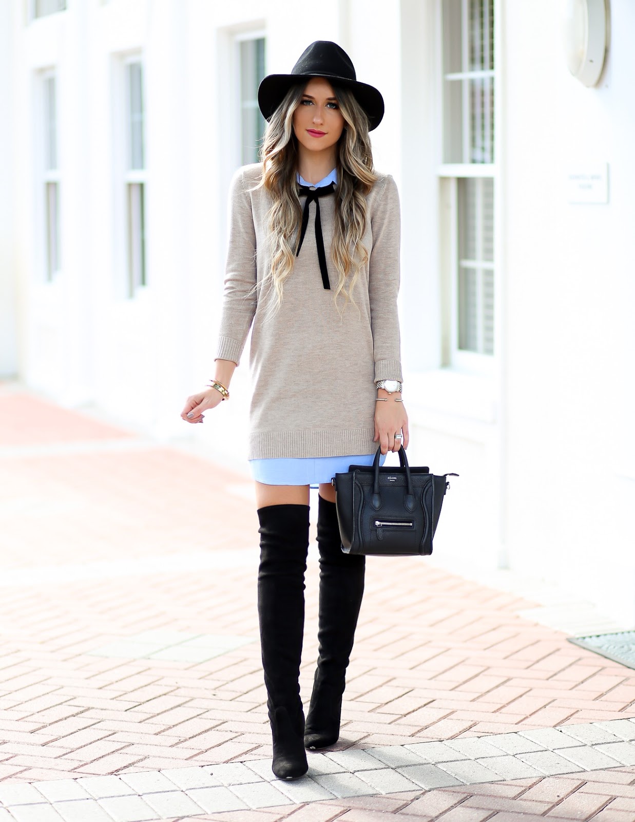 Black sweater dress with store over the knee boots